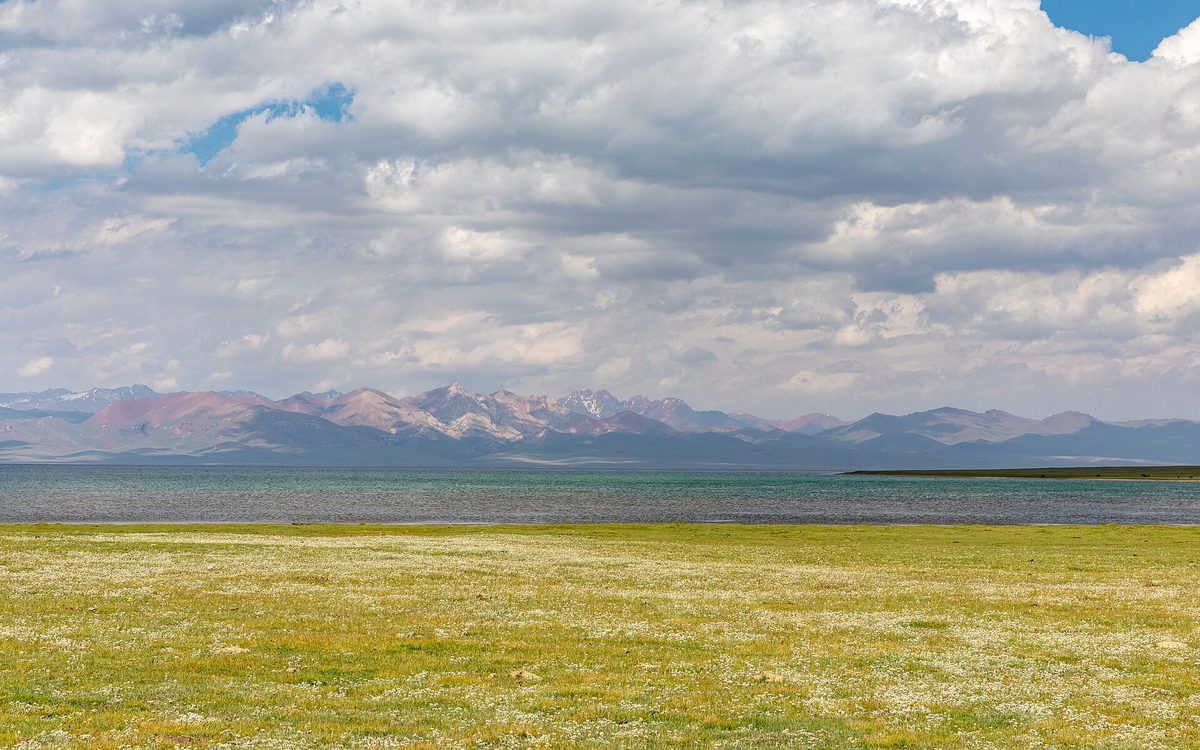 Yurt camp on the shore of Song-Kul lake at dusk