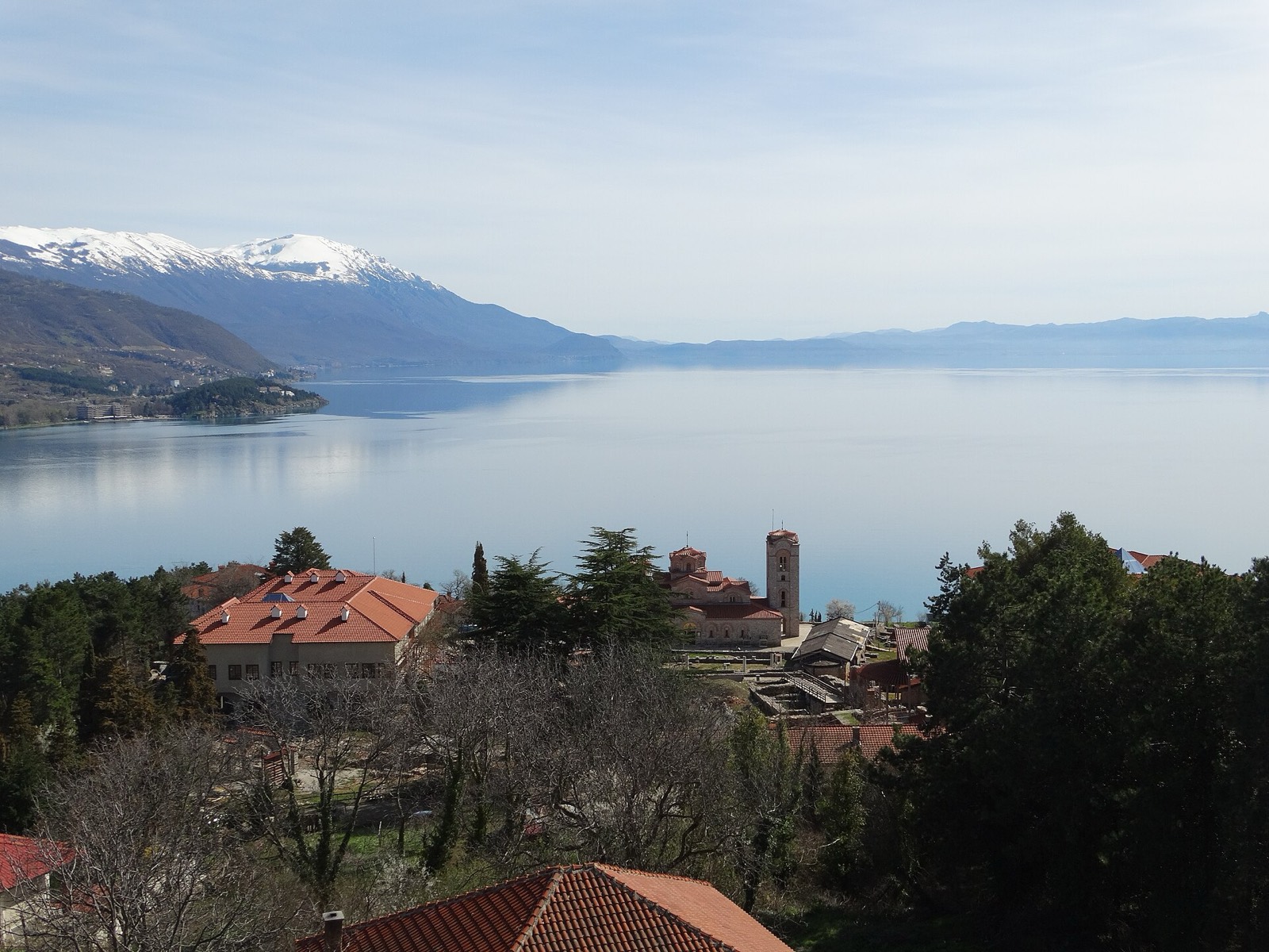 Lake Ohrid with the church of St. John at Kaneo and snow-capped mountains